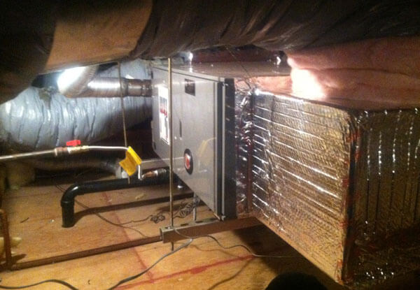 Attic air handler and insulated ducts