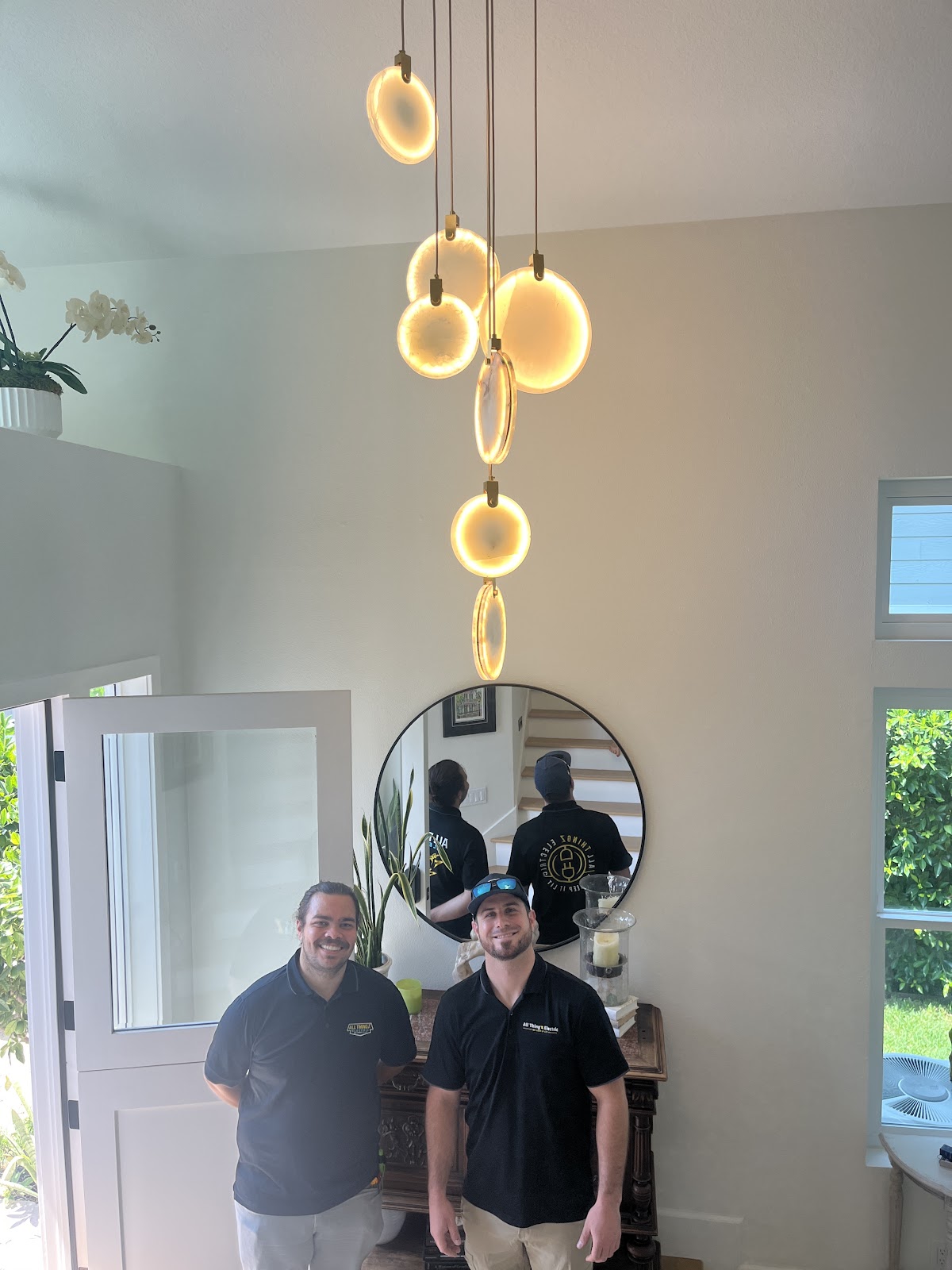 Warm pendant cluster, two-story entryway