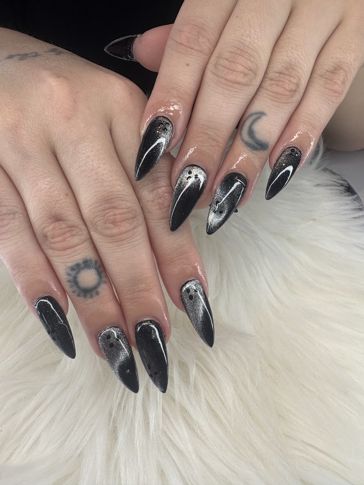 Nail art at Blooming Nails: Black and silver cat-eye stiletto