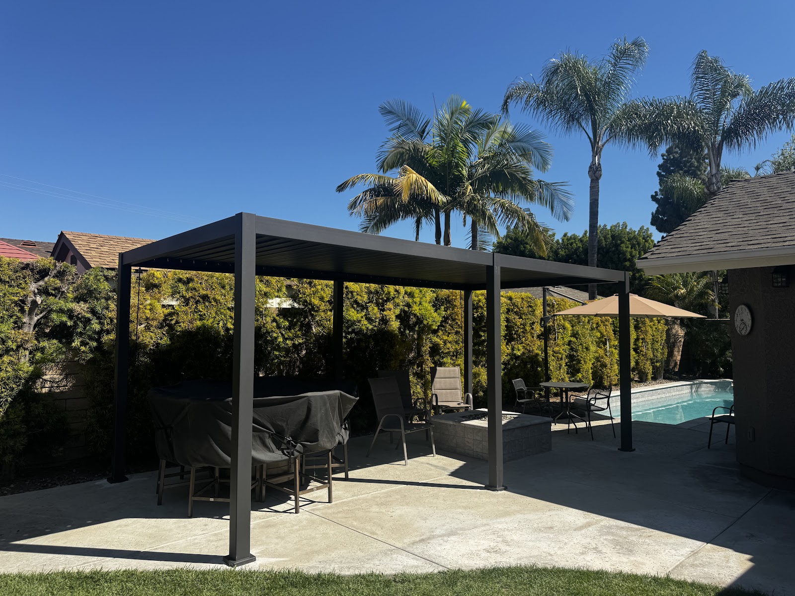 Aluminum louvered pergola, poolside