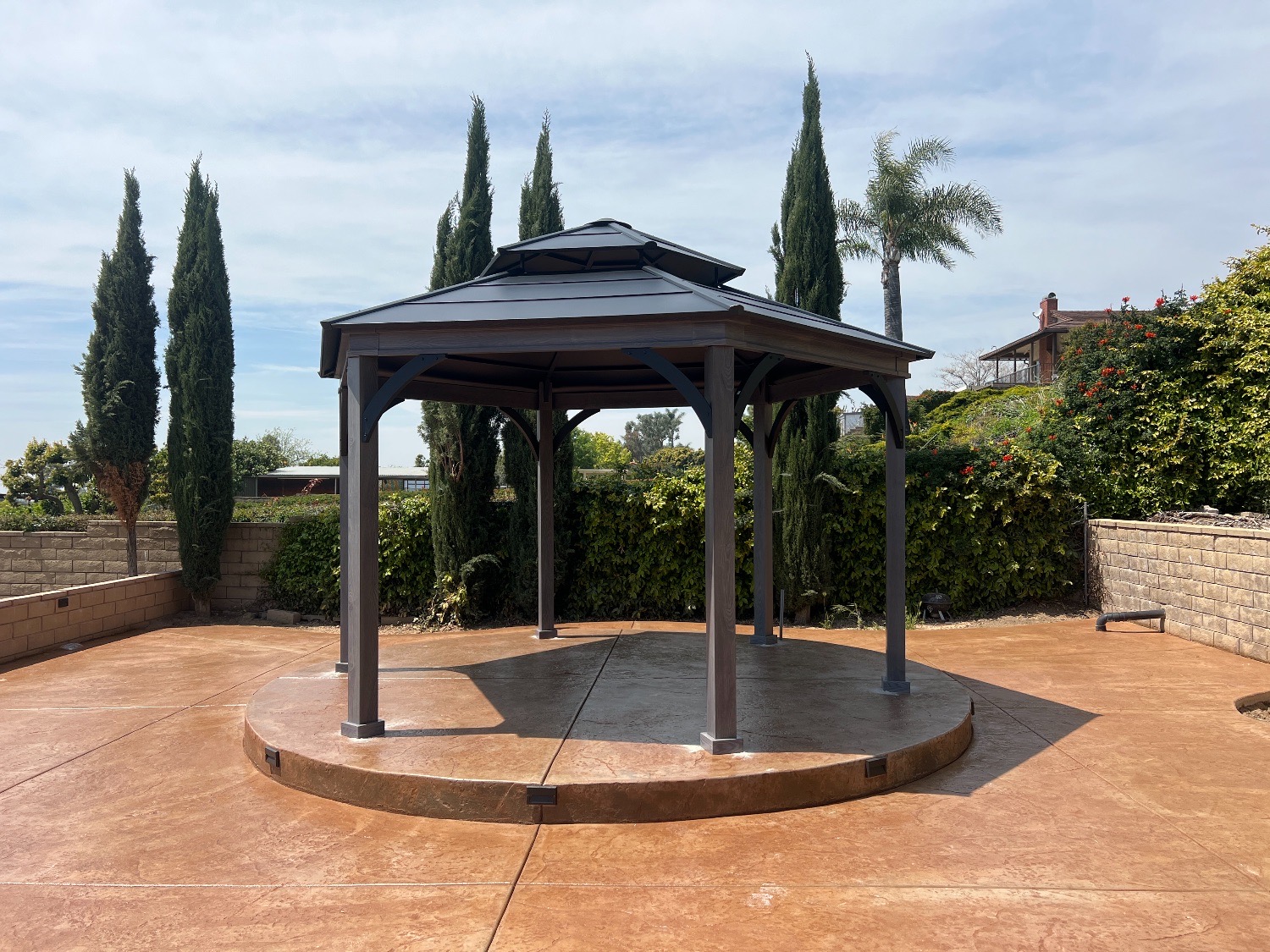 Two-tier hardtop gazebo, stamped concrete, cypress