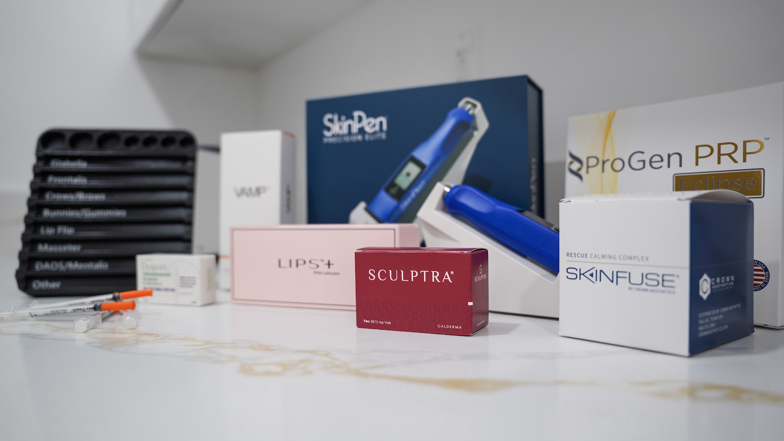 Medical-grade skincare and devices on a marble counter