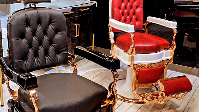 Premium red and copper barber chairs at EMS Barbershop
