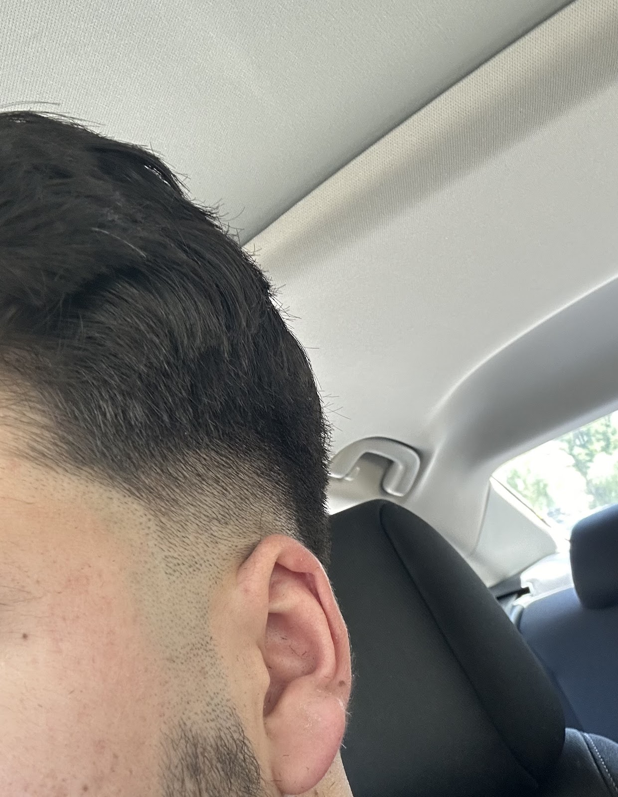 Low taper fade detailed at the nape at Faint Blends Barbershop