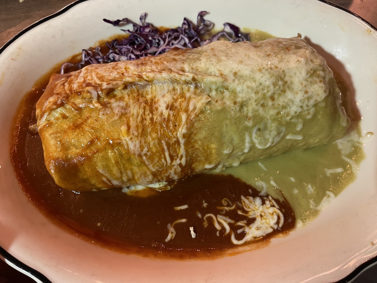 A wet burrito smothered in chile verde