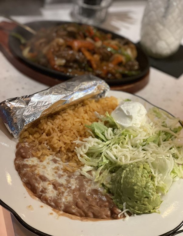 A sizzling fajita skillet