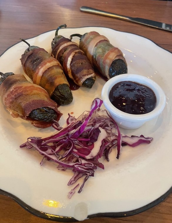 Bacon-wrapped jalapeños with a sweet dip
