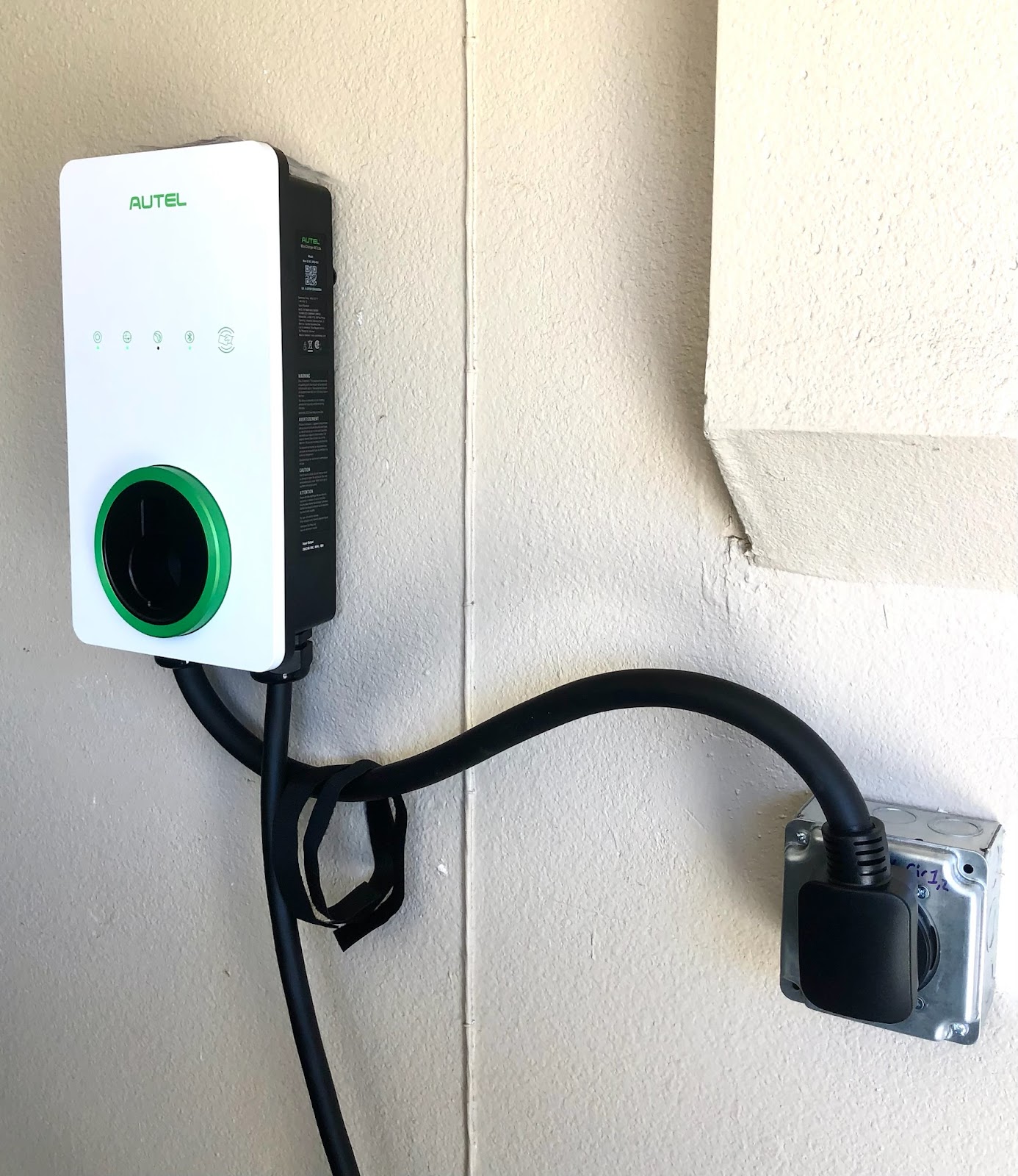 Autel Level 2 home EV charger wired to an exterior junction box by Gerhard Electric