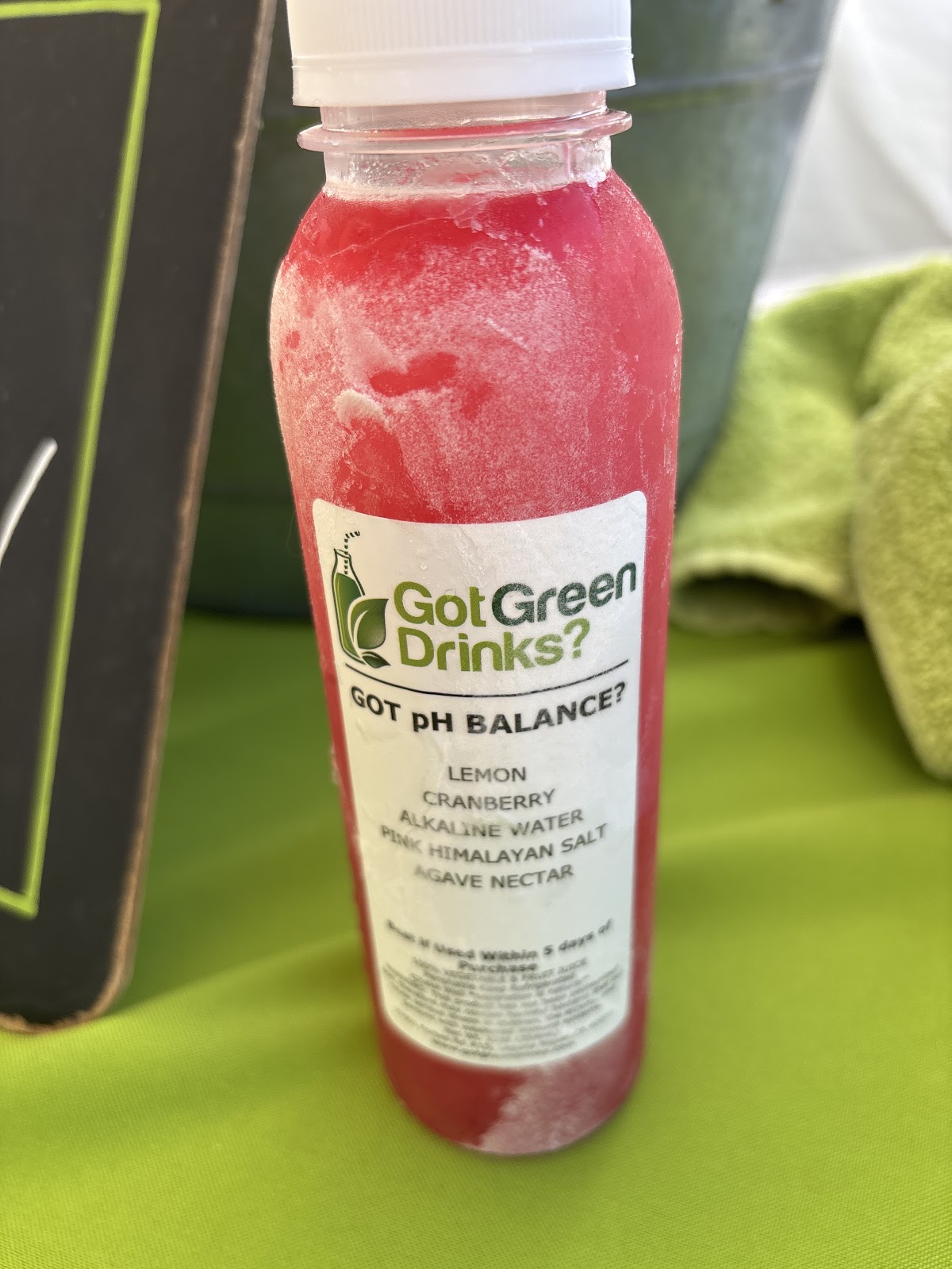 A frozen pink Got pH Balance bottle, made with lemon, cranberry, alkaline water, pink himalayan salt and agave