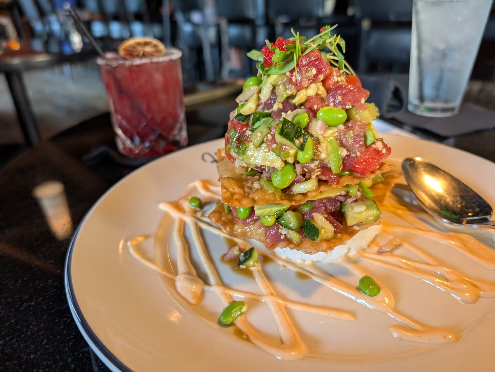 Ahi Tower at Hanna's Prime Steak. Sashimi-grade ahi, avocado, sushi rice, toasted macadamia, edamame, sriracha aïoli. The room's favorite starter.