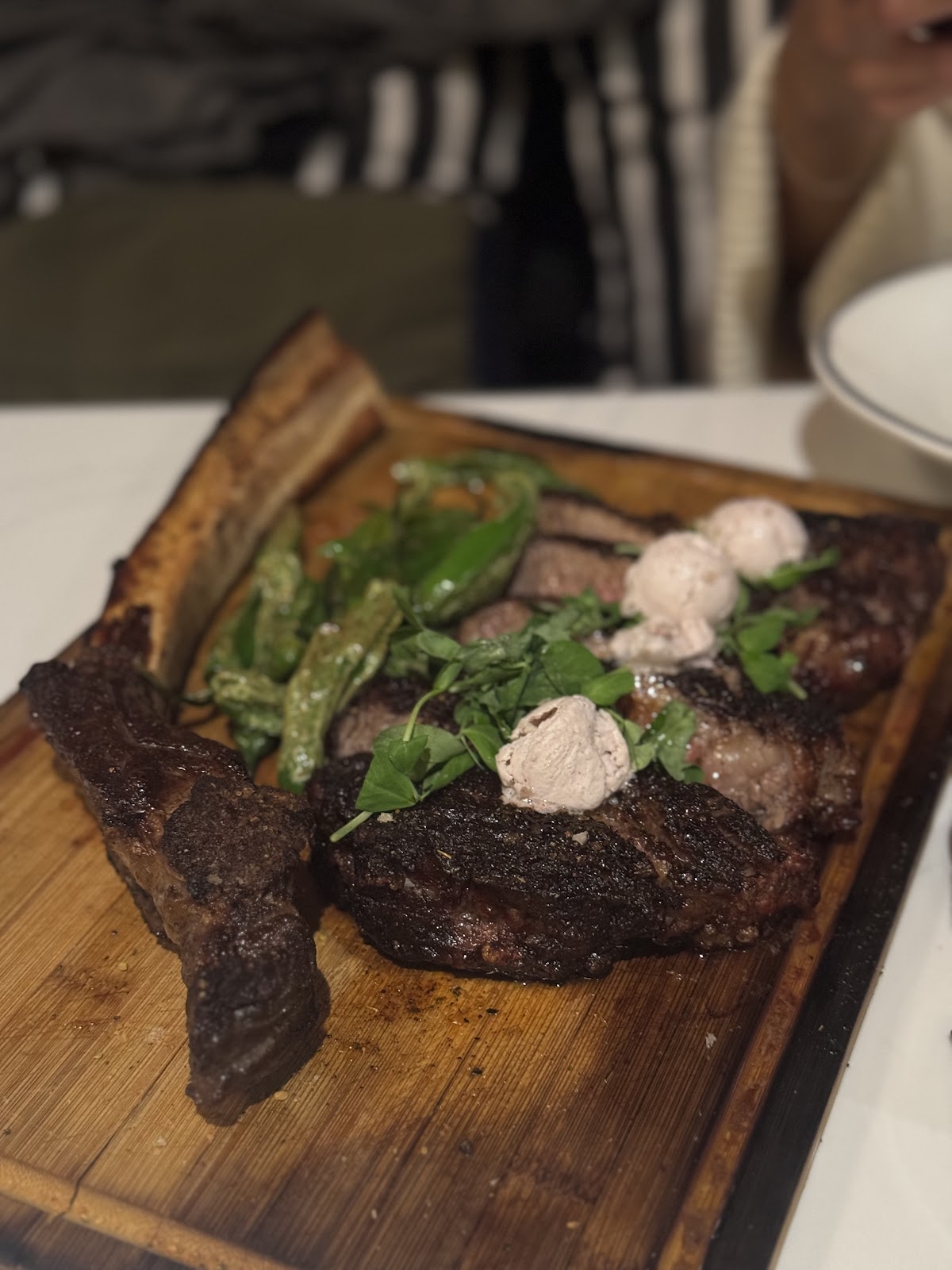 32 oz Porterhouse · for two at Hanna's Prime Steak. The shared cut, broiled hot, finished with the merlot butter.