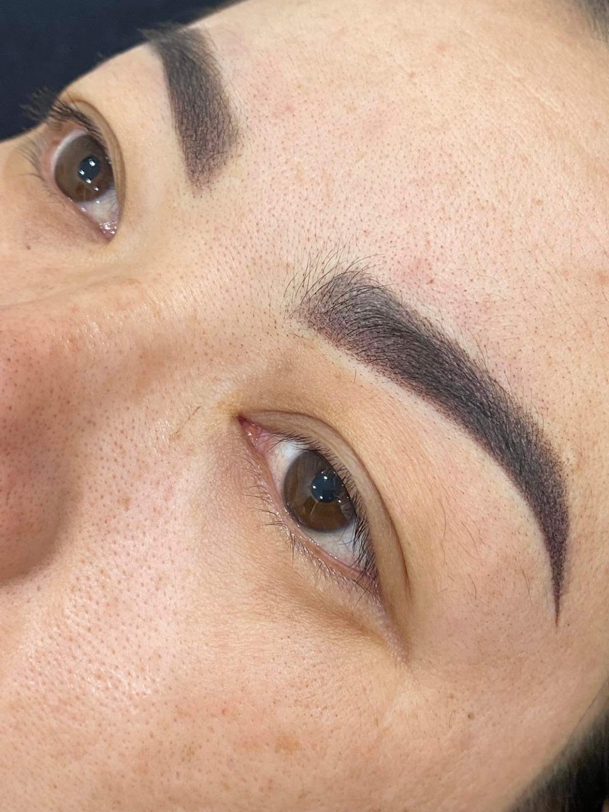 Extreme macro of a brow and lash detail at Hello Bailey