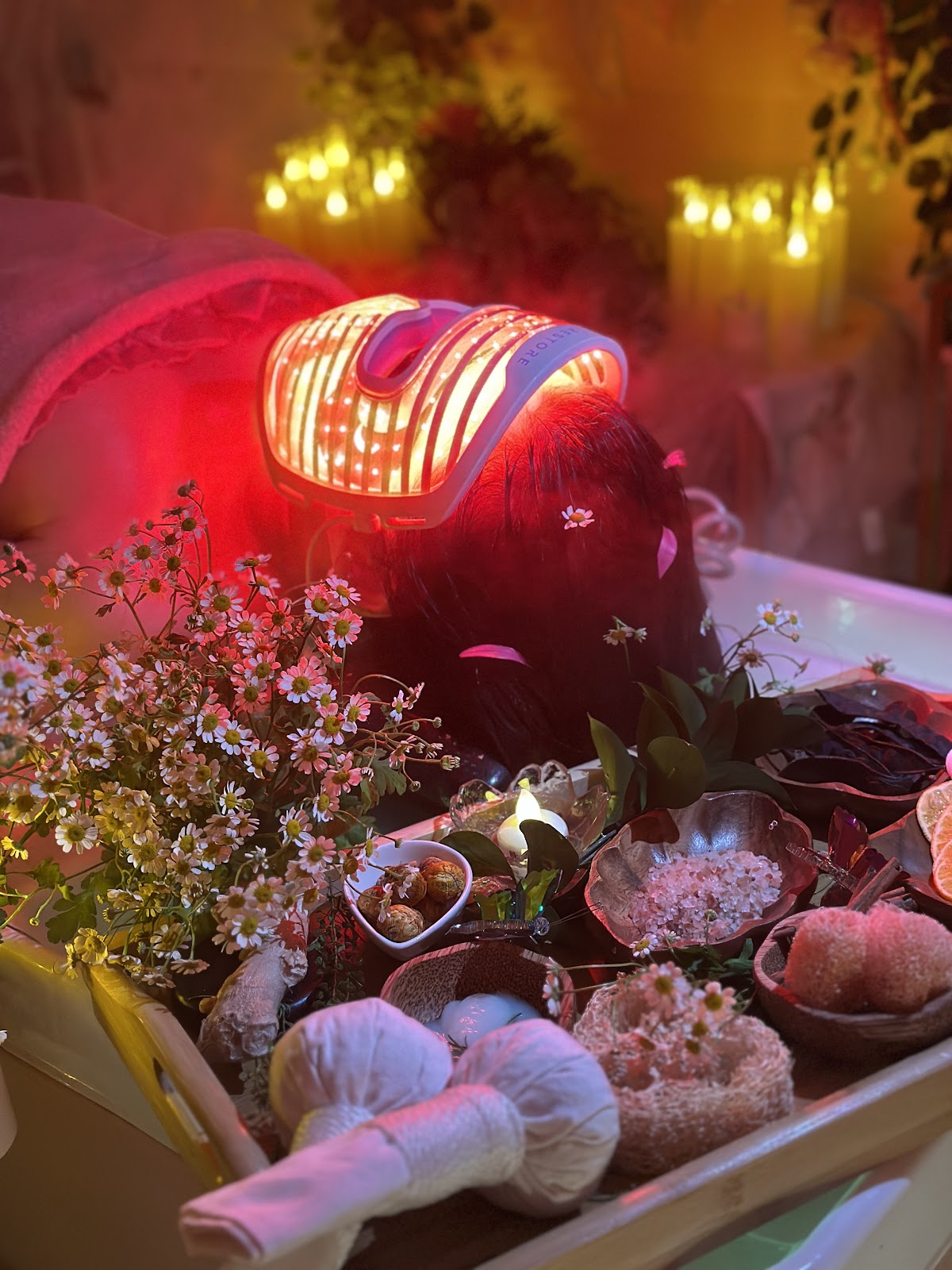 Hello Bailey head spa session with warm red-light therapy and candlelight