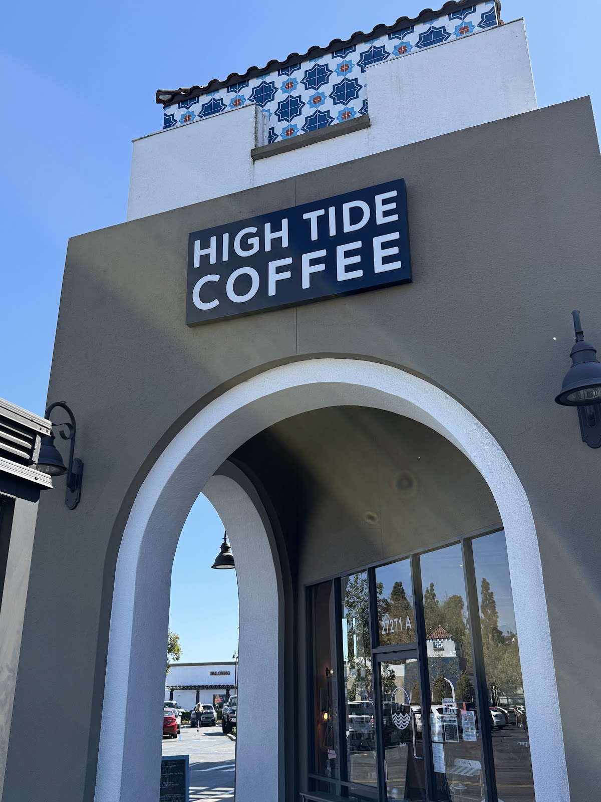 The exterior arched storefront sign at High Tide Coffee on La Paz Road