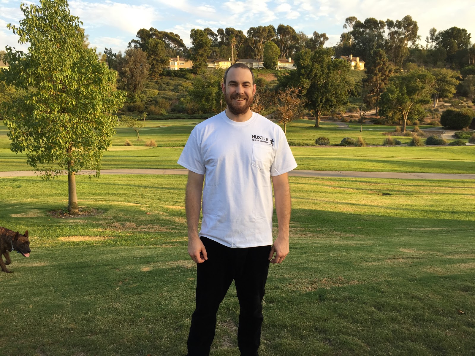 Alex outdoors in a Hustle shirt