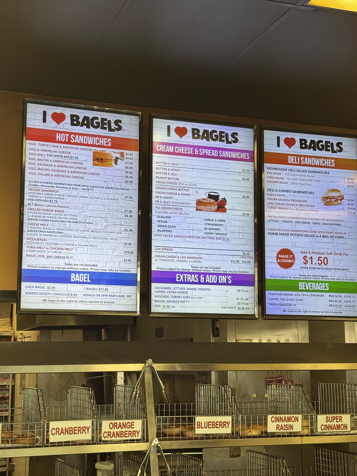 A fresh bagel split and spread with house-made whipped cream cheese