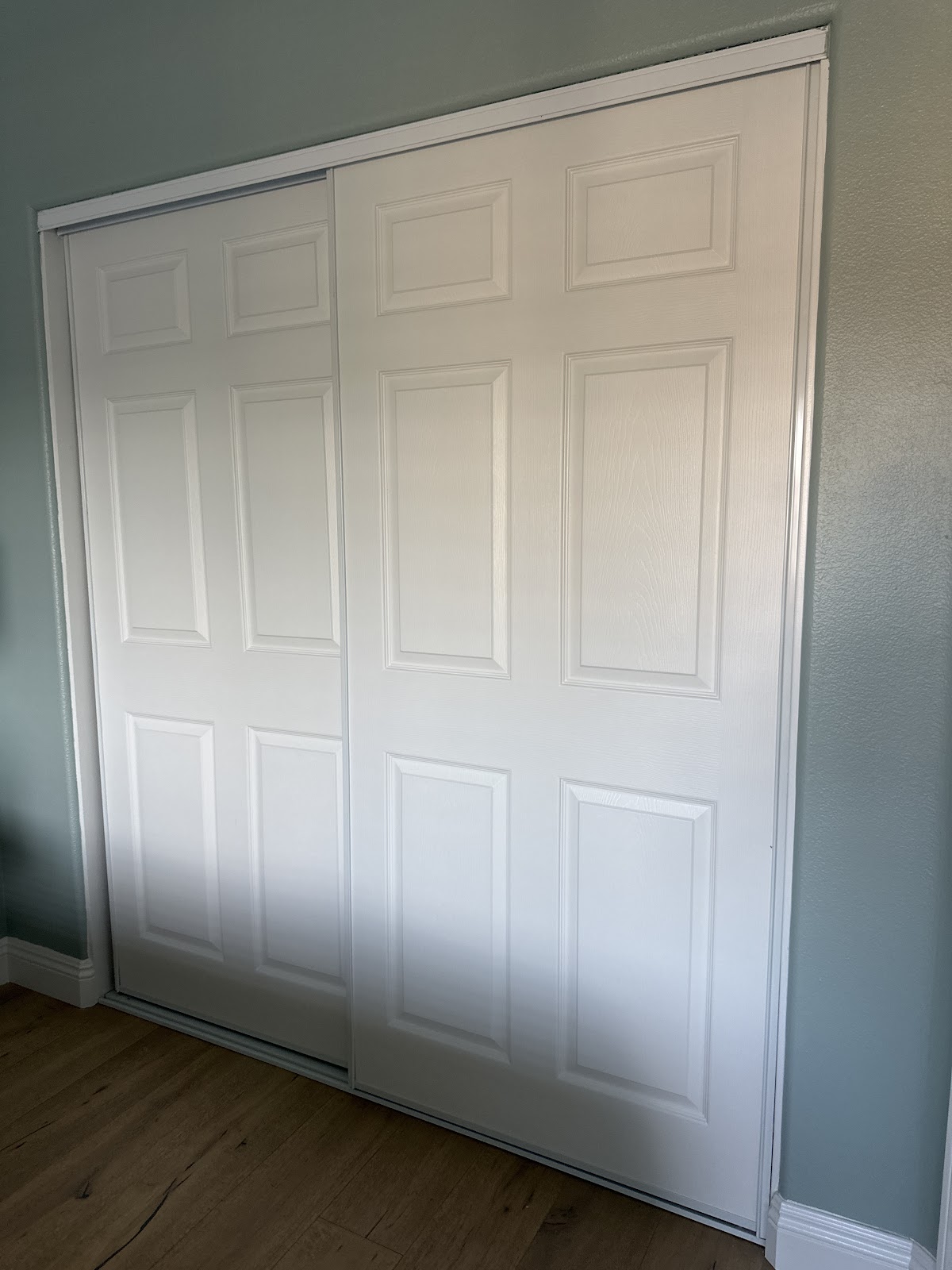 White six-panel sliding closet doors