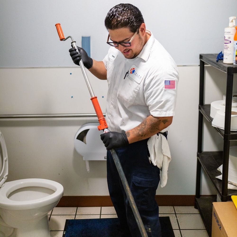 Kalka technician servicing a commercial drain line