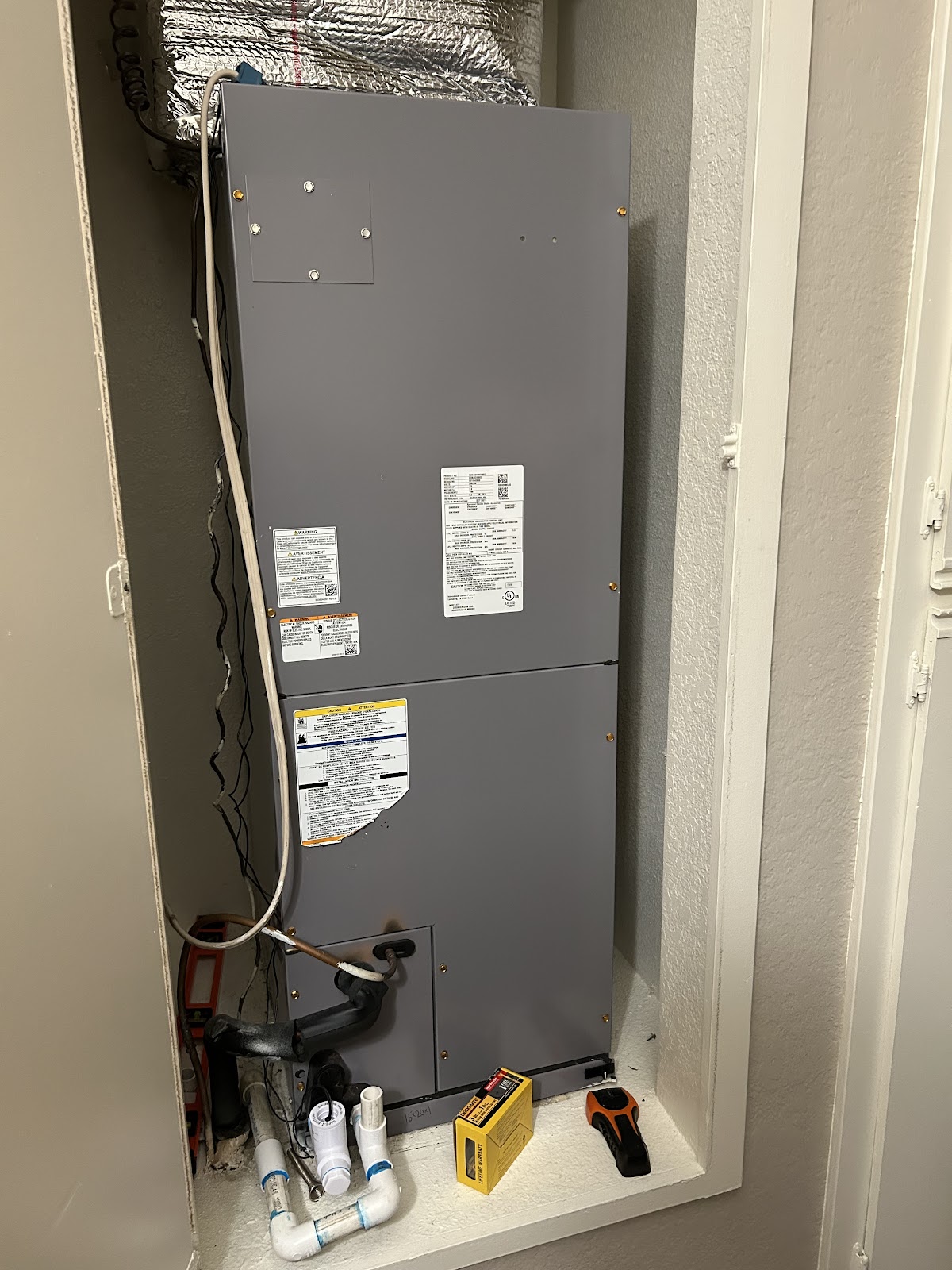 Vertical furnace and air handler installed in a closet by Kalka
