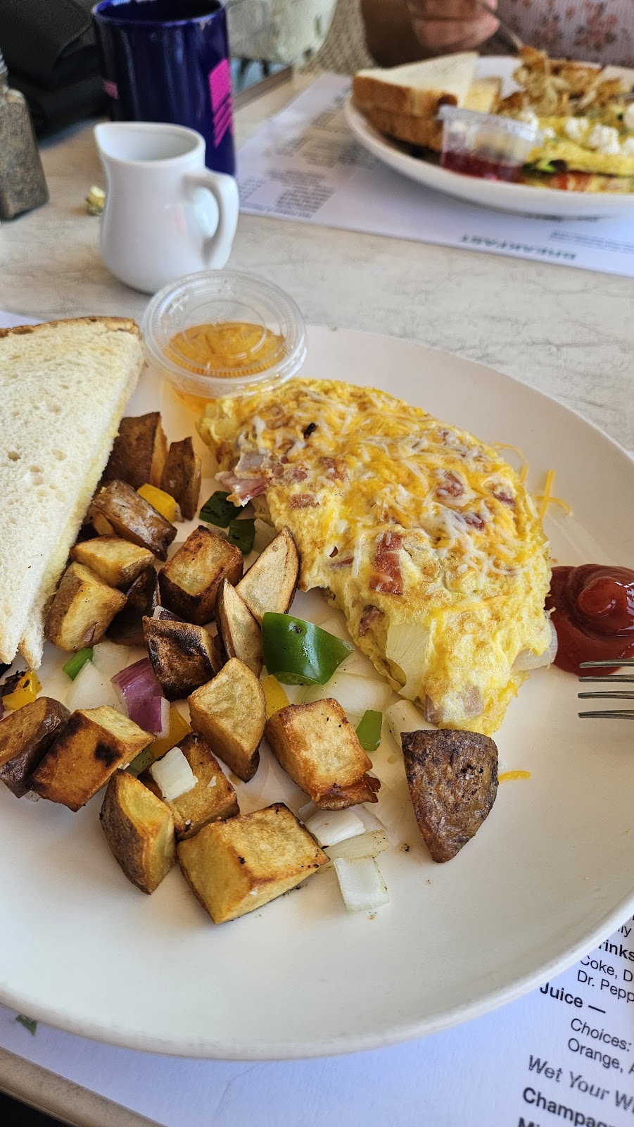 An omelette with home-fried potatoes