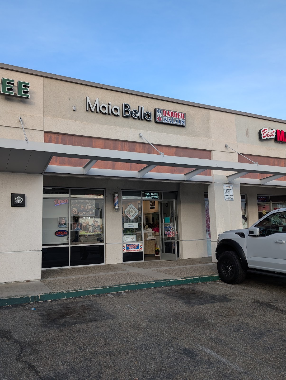 The Maia Bella storefront on Trabuco Road in Lake Forest. Maia Bella Barber & Salon sign, barber pole, Walk-Ins Welcome sign on the door