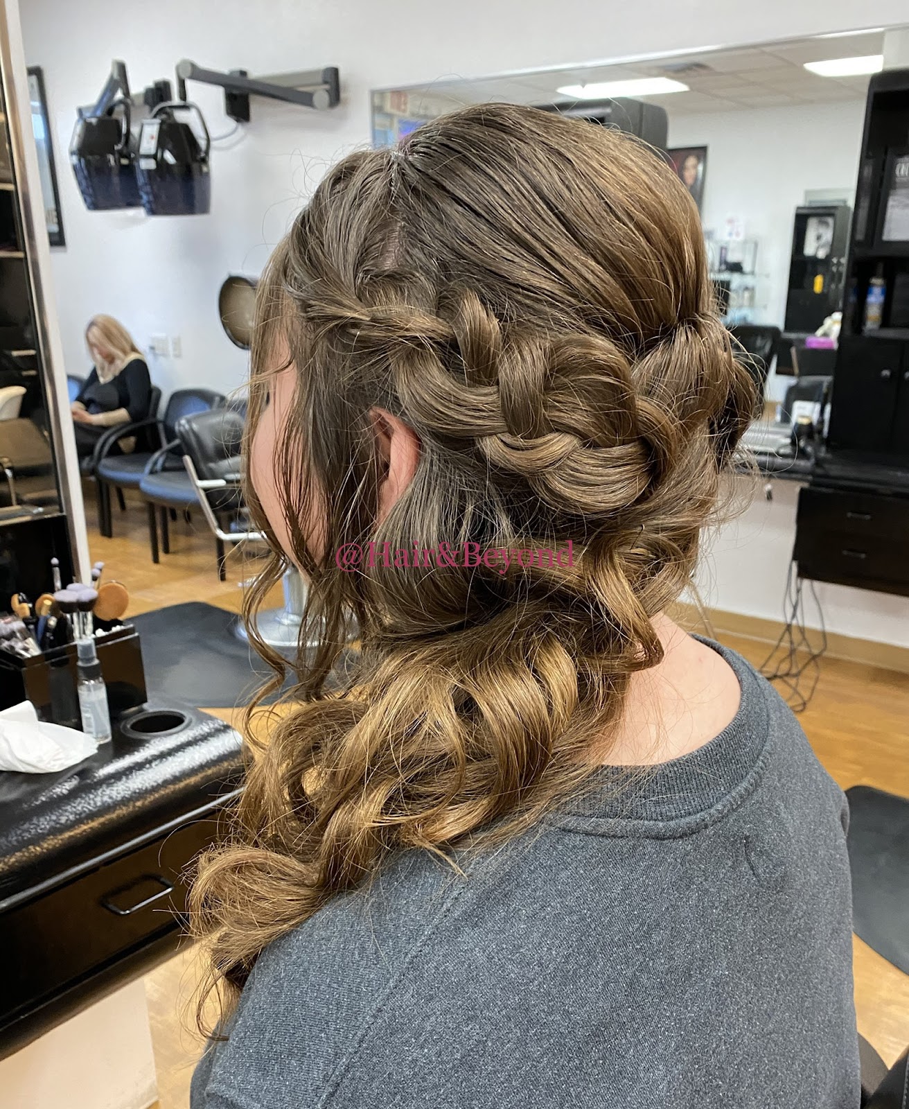 A braided style from behind at Maia Bella, soft loose braids cascading down
