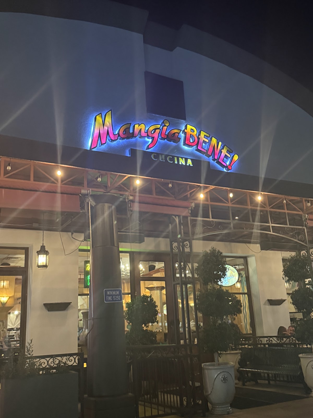 Mangia Bene Cucina lit up at night