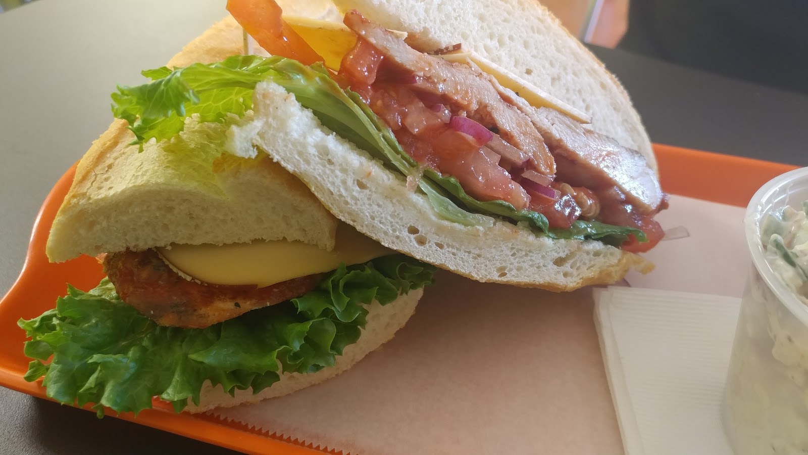 Hot and Spicy Chicken at Noonerz. Spicy breaded chicken, jack, cilantro almond relish, lettuce, tomato on rosemary ciabatta. The one people sweat at slightly.