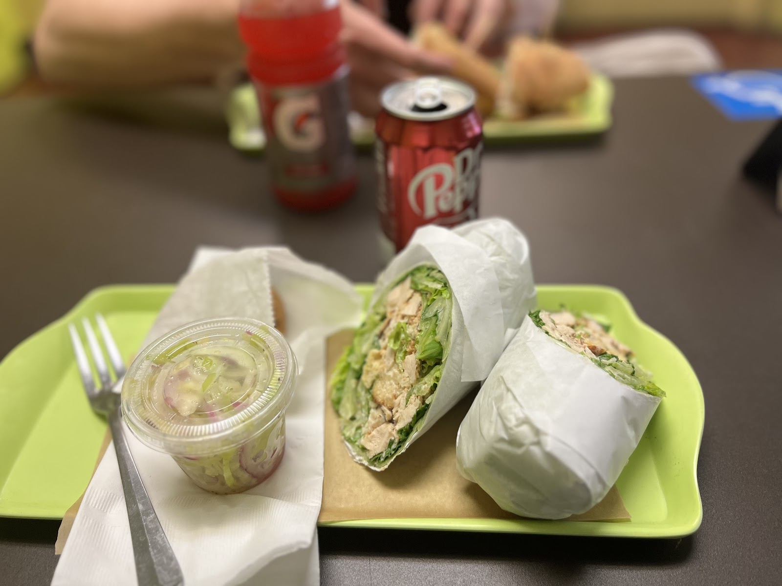 Chicken Caesar Wrap at Noonerz. Grilled chicken, romaine, croutons, parmesan, house caesar in a spinach tortilla. The clean lunch order.