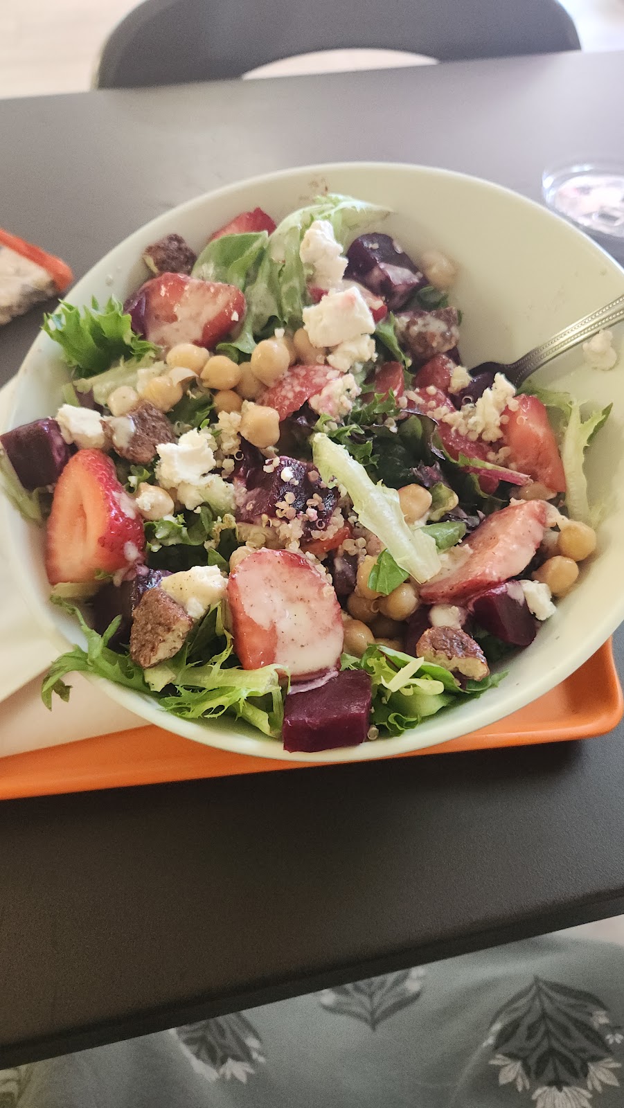 Beet and Berry Salad at Noonerz. Mixed greens, quinoa, strawberry, chickpeas, goat cheese, blue cheese, candied pecans, golden balsamic. The healthy lunch.