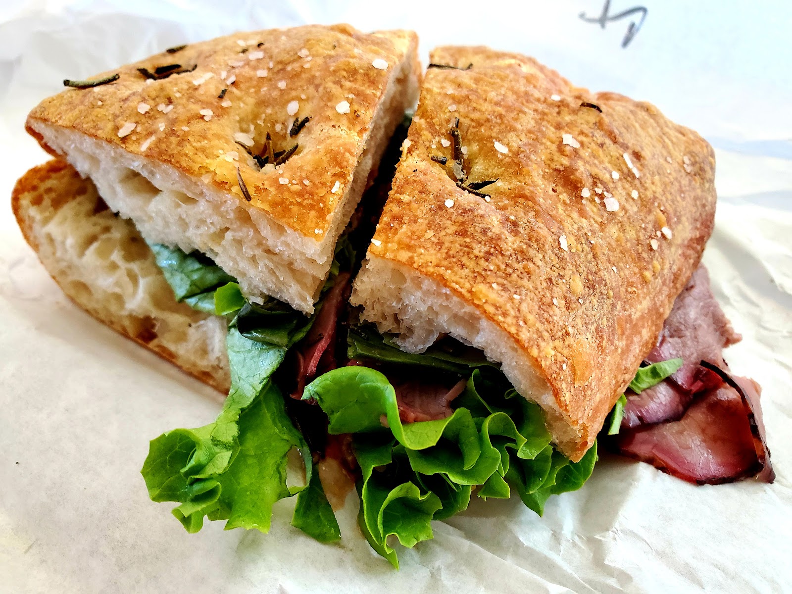 Roast Beef at Noonerz. Thinly sliced roast beef, fresh basil, spicy tomato chutney on rosemary ciabatta. The other thing the regulars order.