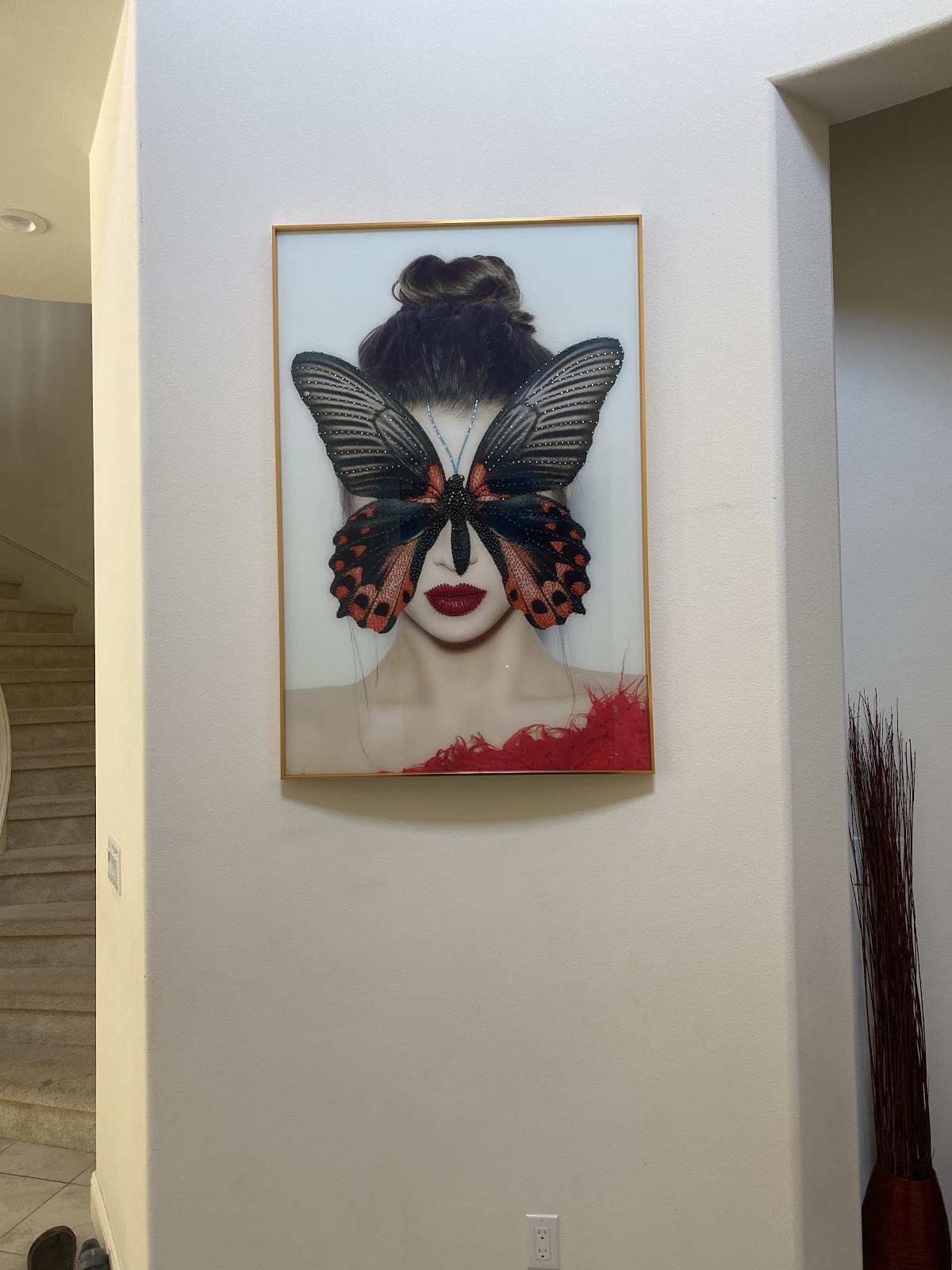 Heavy framed art, hung straight in the entry