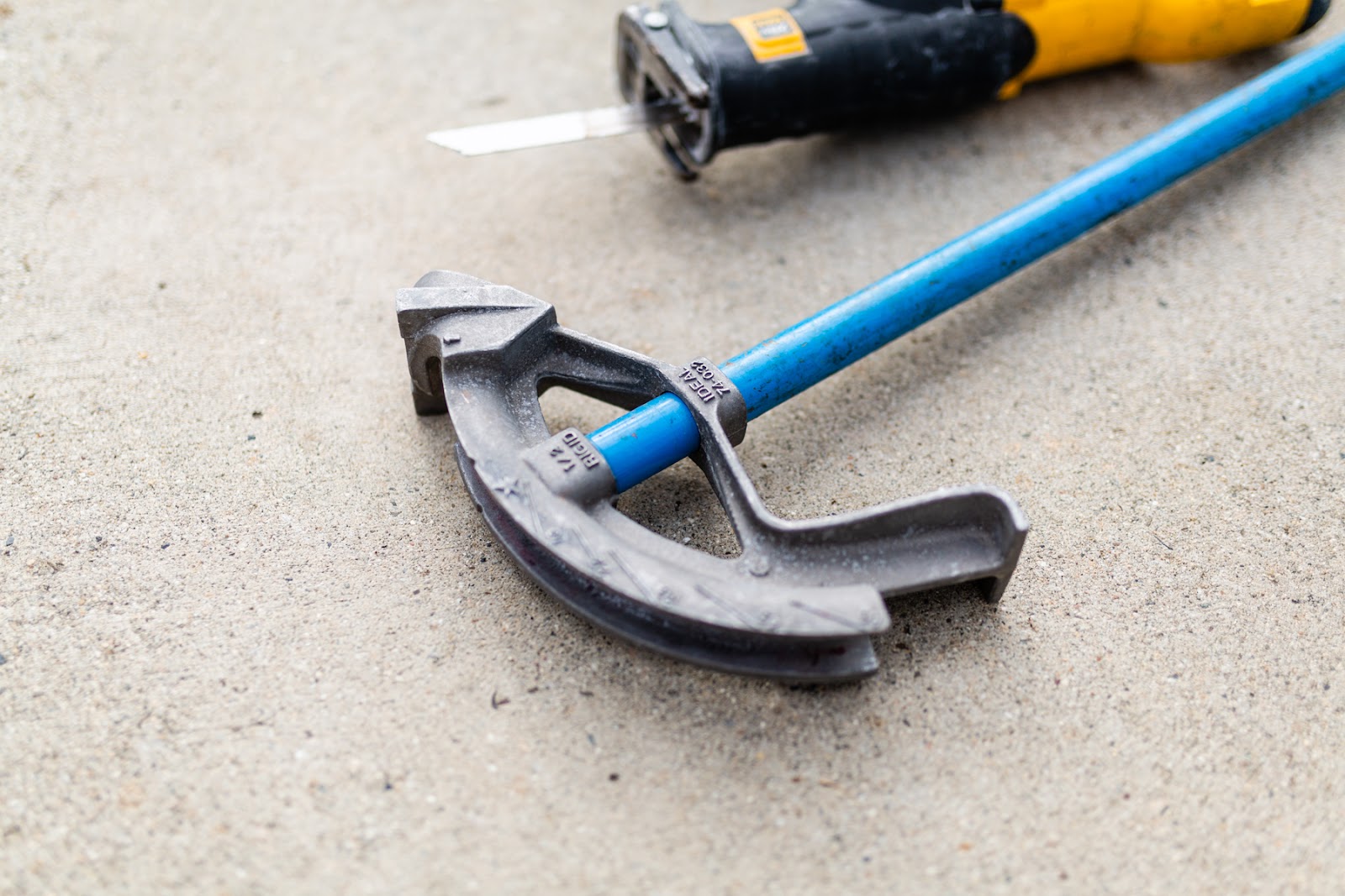 Conduit bender and reciprocating saw, on the job