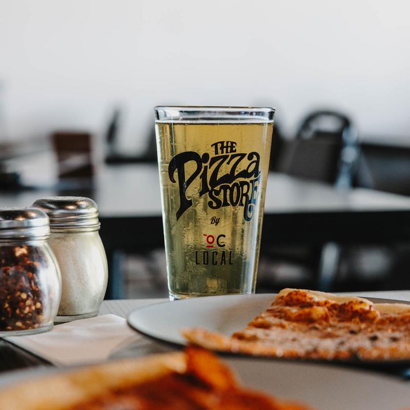 A drink and slices at The Pizza Store