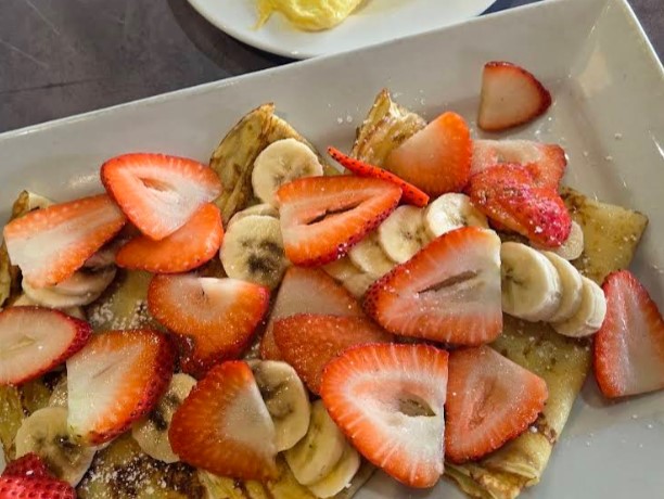 Strawberry banana crepes at Plumeria Cafe, dusted with powdered sugar