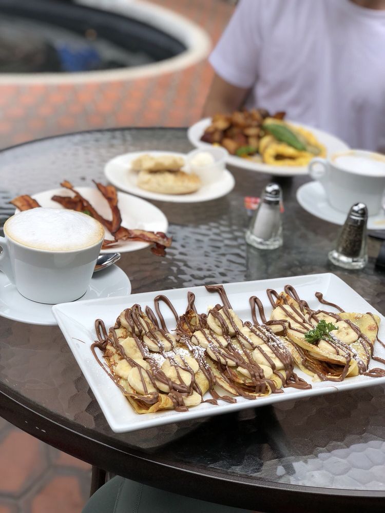 Nutella banana crepes at Plumeria Cafe, on the patio with a cappuccino