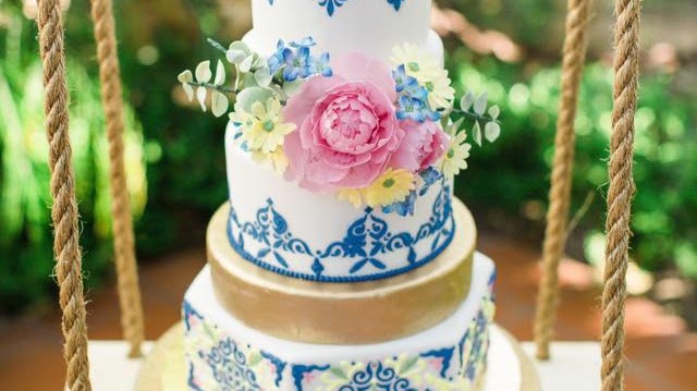 A blue-and-white floral wedding cake by Plumeria