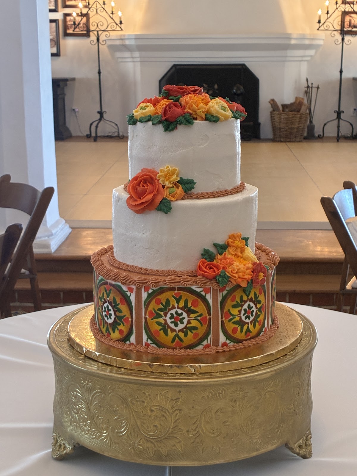 A cake topped with bright orange blooms