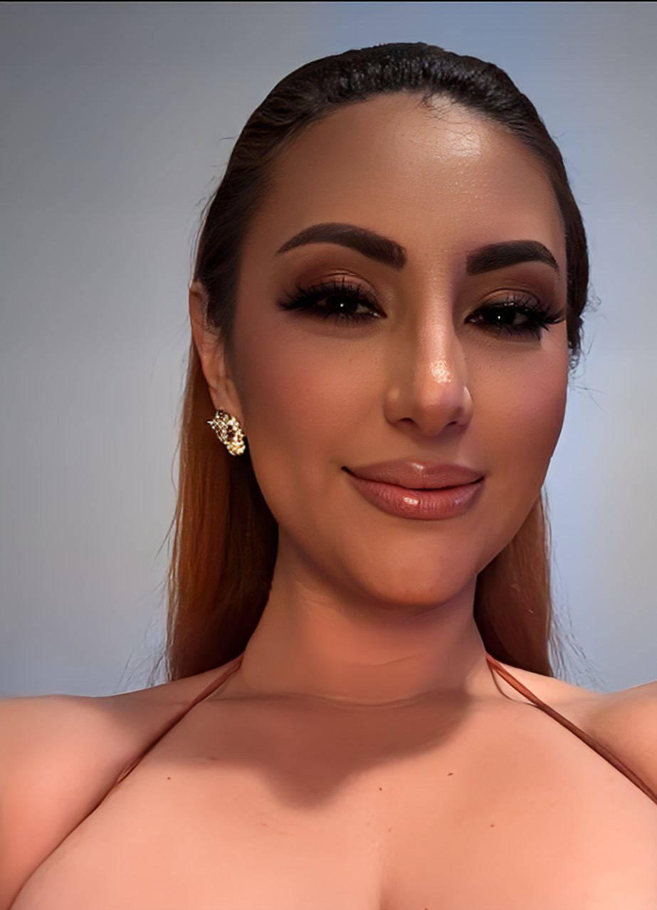 A guest with luminous, glowing skin after treatment at Refined Radiance Aesthetics