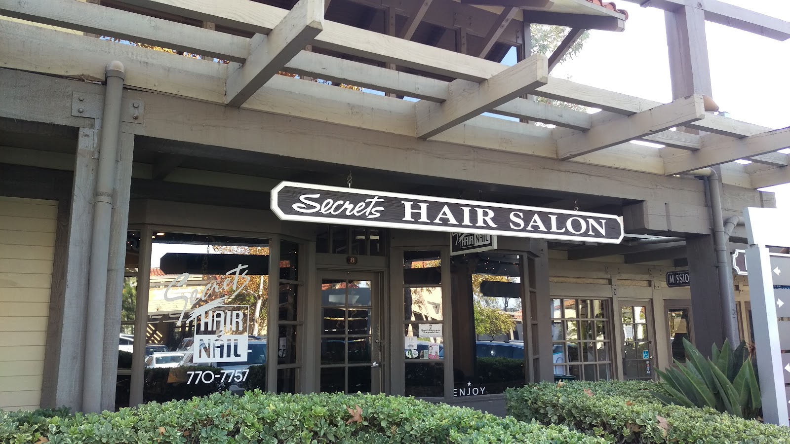 The Secrets Hair Salon storefront sign in the Mission Viejo shopping center