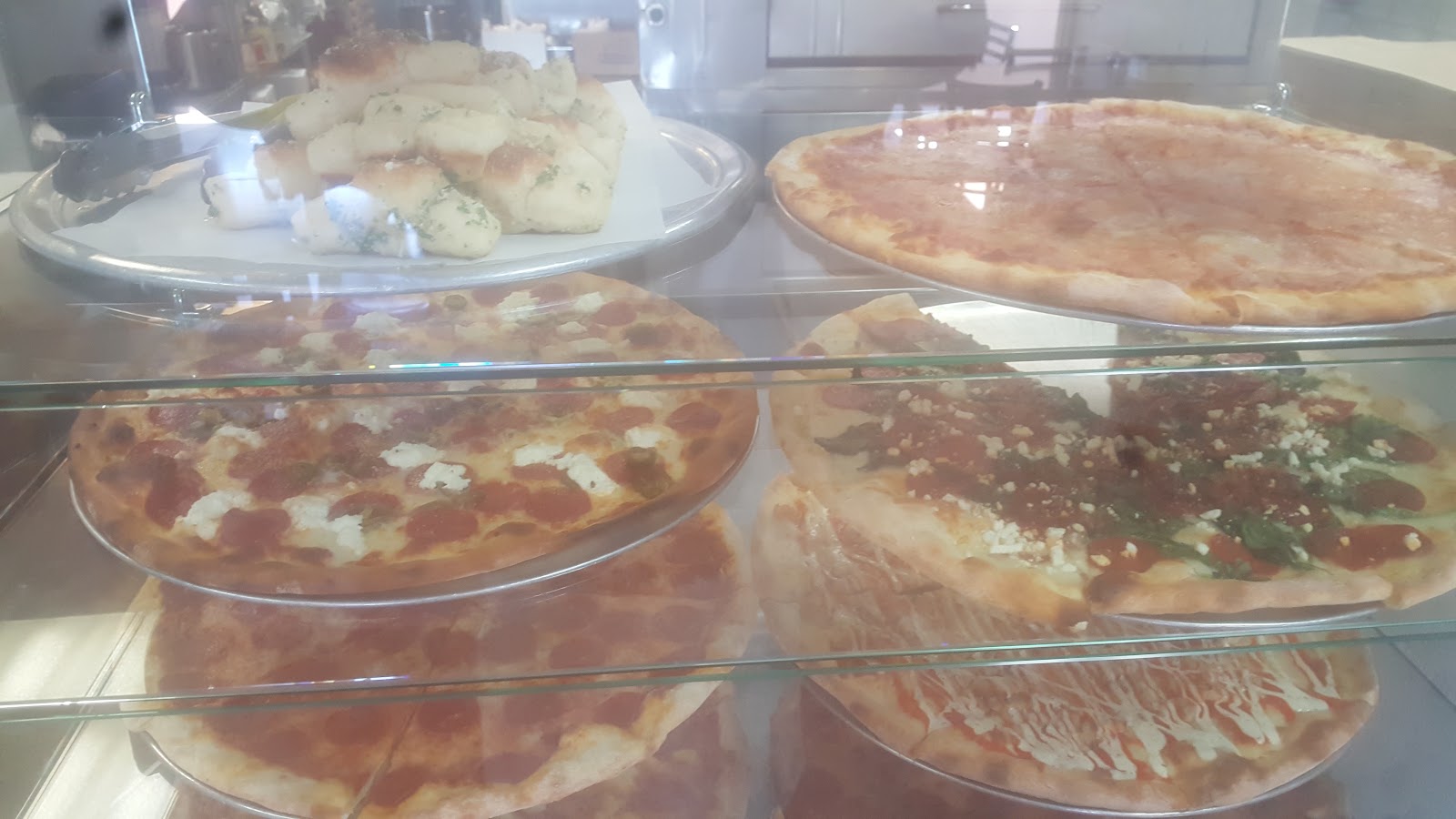 White Spinach Garlic at Terra Mia Pizzeria. Olive oil base, ricotta, mozzarella, spinach, fresh garlic. The pie for people who don't want sauce.