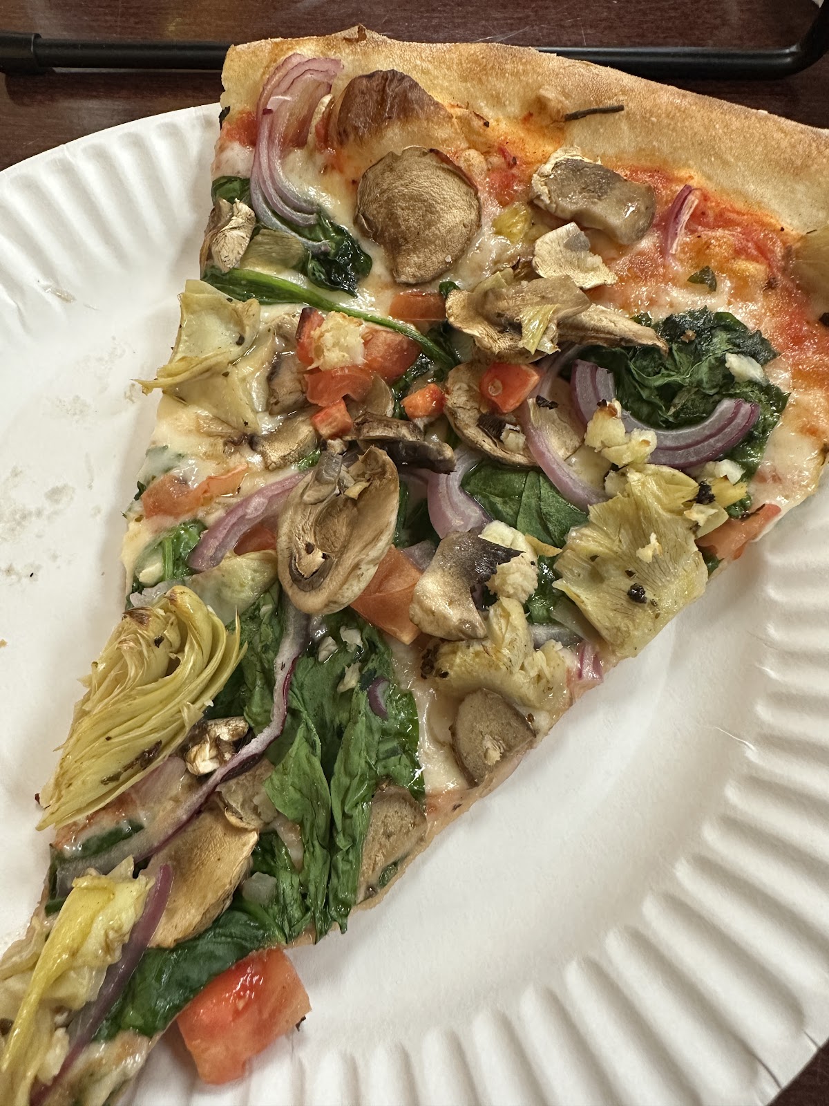 Artichoke Spinach Mushroom at Terra Mia Pizzeria. Artichoke heart, spinach, mushroom, red onion, tomato. The slice you didn't expect to order twice.
