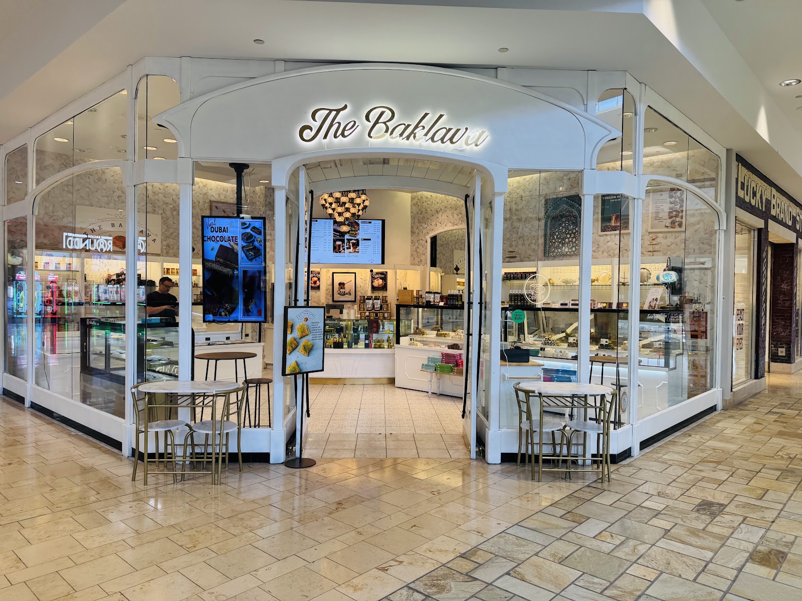 The Baklava storefront with glass cases of baklava inside