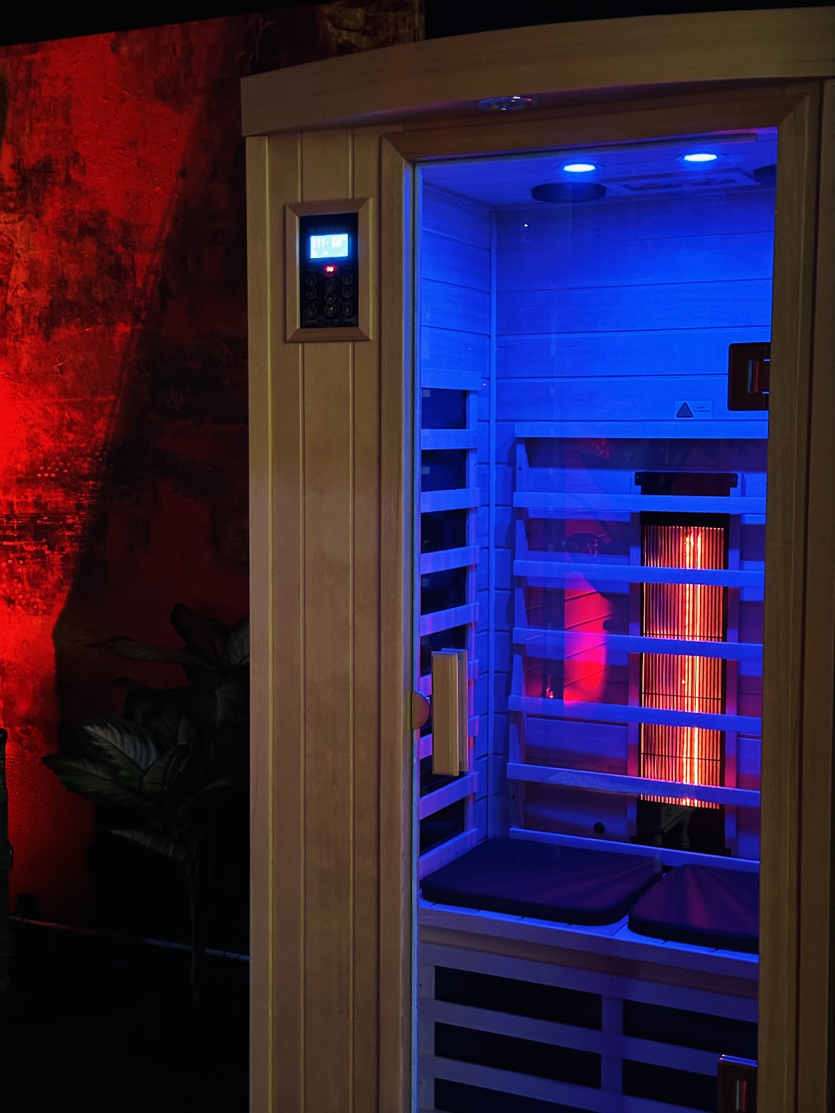 A close look at the infrared coils glowing through the wooden interior of the sauna cabin