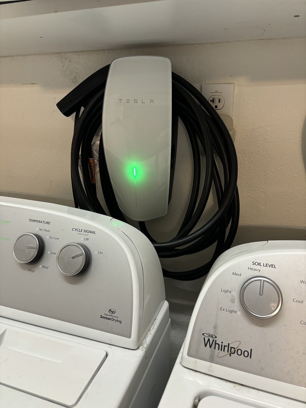 Tesla charger beside the laundry, tidy run