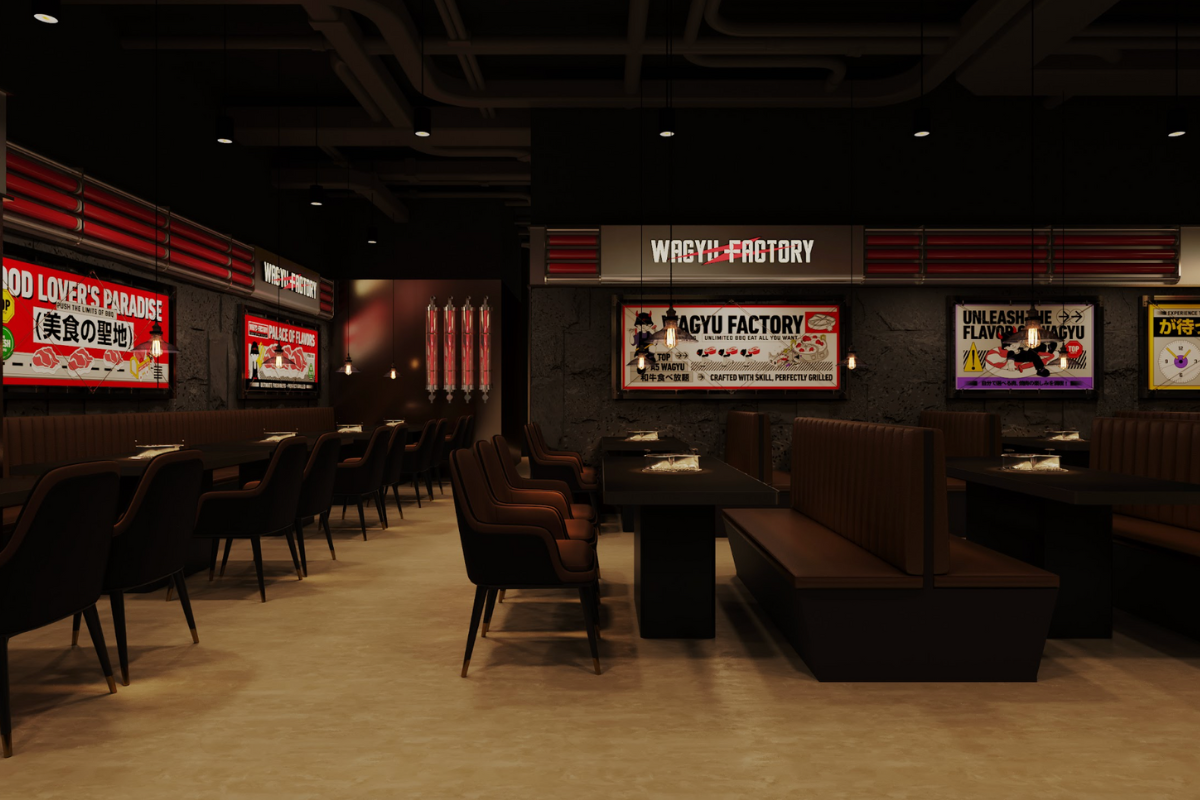 The Wagyu Factory Lake Forest dining room with booths, dark walls, and red illuminated signage